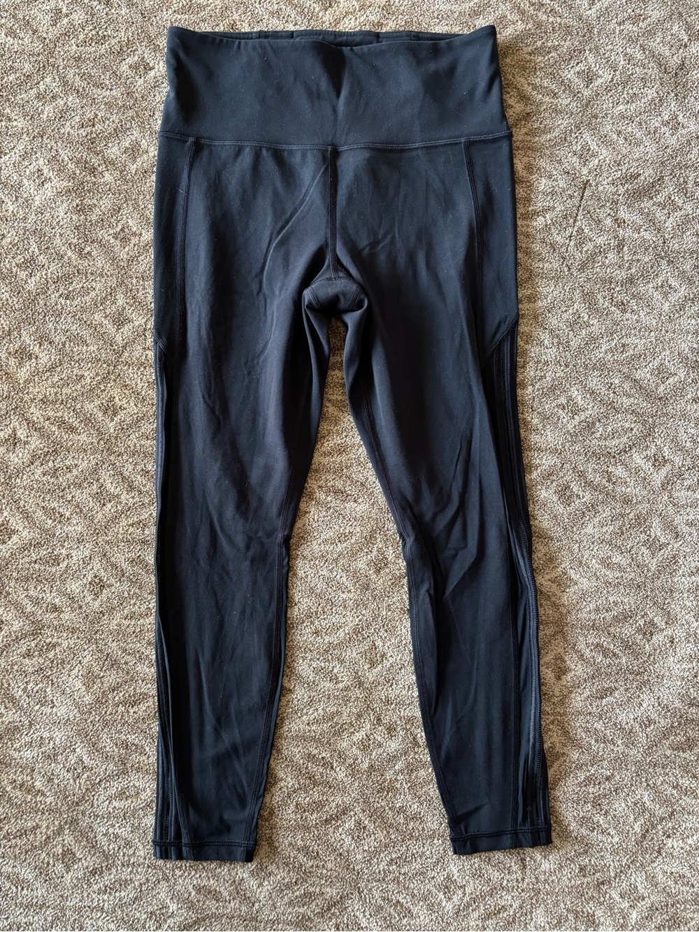 Athleta High-Waisted 7/8 leggings with a mesh panel down the side